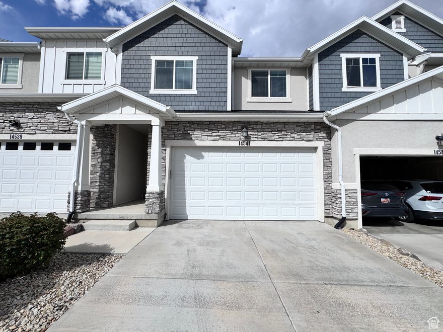 Incredible Value: Two Homes in One in Herriman  Discover the ideal solution for multi-generational living or shared housing with this great townhome. This property is uniquely designed with two complete living spaces, each with its own kitchen and laundry room, providing unparalleled privacy and convenience.  The main home offers 4 bedrooms and 2.5 baths, while the lower-level mother-in-law apartment provides a private sanctuary with 1 bedroom and 1 bath.  Enjoy the elevated location in this premiere community, which boasts stunning views of the valley and better air quality. The home is just a short drive from the Mountain View Corridor, making travel effortless. You'll also be just minutes from Mountain View Village's popular shops and restaurants. This home features modern amenities like a tankless water heater and a beautiful two-tone paint finish.