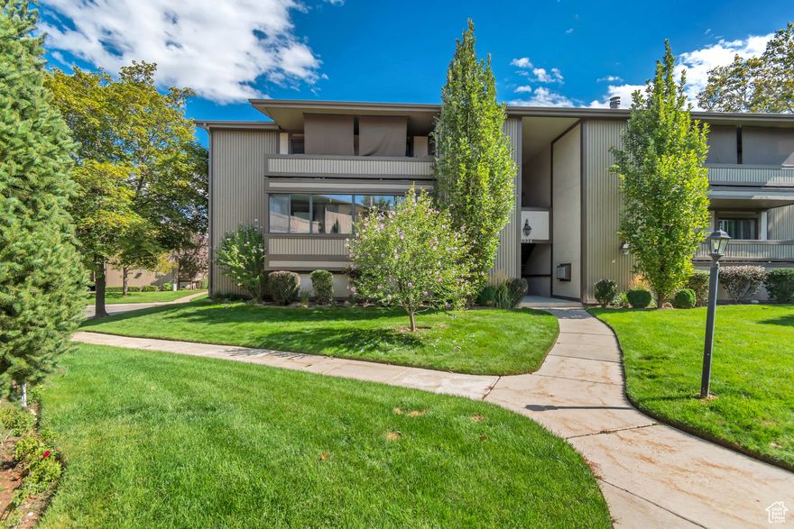 Location doesn't get much better than this top unit in coveted and gated Fairmeadows! Enjoy a large kitchen/family room with a wonderful view of the grounds, NEW PAINT NOVEMBER 2025, light fixtures and trim.  Two bedrooms with walk in closets and two baths along with large in unit laundry (washer and dryer are included). In-building two car garage. Beautiful grounds include pool, club house and fenced dog park.  Quick access to I-215 and all the Ft. Union area has to offer with restaurants, shopping and quick access to our world-famous canyons.  Information is deemed correct, but buyer is advised to verify all.  Please enter from 900 East. TV in living room is excluded