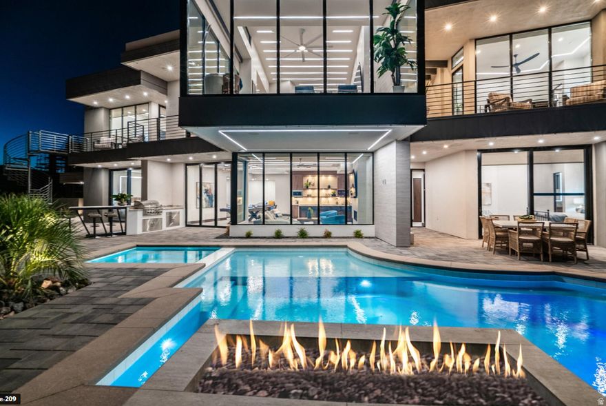 The Luxe at Copper Rock is more than a home-it's an opportunity. Perfect as a nightly rental income property, a corporate retreat, or a family vacation escape, this residence is designed to deliver both lifestyle and investment potential. Walls of glass and open-concept living spaces blur the line between indoors and out, drawing in golf course and red rock views at every turn. The gourmet kitchen flows effortlessly to expansive dining and living areas, while bedroom suites provide spa-inspired retreats with private patios. Step outside to a private resort-style oasis featuring a sparkling pool, covered lounge areas, and plenty of room for entertaining. Whether hosting a gathering or relaxing with family, the design centers around seamless indoor/outdoor living. Set within the prestigious Copper Rock Golf Course community, you'll be minutes from Sand Hollow Reservoir, Zion National Park, and endless trails for boating, hiking, and off-road adventure. The Luxe at Copper Rock combines modern sophistication with adventure-driven living an investment and retreat unlike any other.