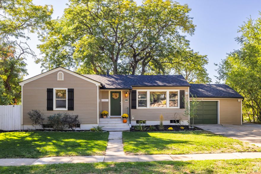 TAKE ADVANTAGE of SELLERS OFFER for $12,500 to BUY DOWN YOUR INTEREST RATE or ASSIST WITH CLOSING COSTS.  Welcome to 2207 Tyler Ave. located in one of Ogden's most cherished walkable neighborhoods, where Bonneville Shoreline trailhead, hiking, biking and rock climbing and the neighborhood coffee shop are all just a few walkable blocks away. This spacious bungalow offers a large living and dining area that expands out to the deck overlooking the adjacent park and towards sunset skies. Add a gate to the already fenced backyard to create an immediate access to the park to enjoy abundant play space for the family or throw the ball for Rover! Upgrades include new roofing, gutters, vinyl windows, luxury vinyl plank flooring and an updated kitchen and main level bath. The kitchen overlooks the backyard and features quartz counters, tile backsplash, floating shelves and stainless appliances. Bedrooms are roomy and oer multiple windows allowing lots of natural light. Lower level with bedroom, 2nd bathroom, large family room and separate laundry room / storage area. Bonus feature is the extra wide attached garage that allows room for all your recreational gear and double wide driveway accommodating multiple vehicles. Minutes away from the canyon road that provides access to the boundless recreational opportunities of Ogden Valley, including Pineview reservoir and world-famous Snowbasin / Powder Mountain ski resorts.