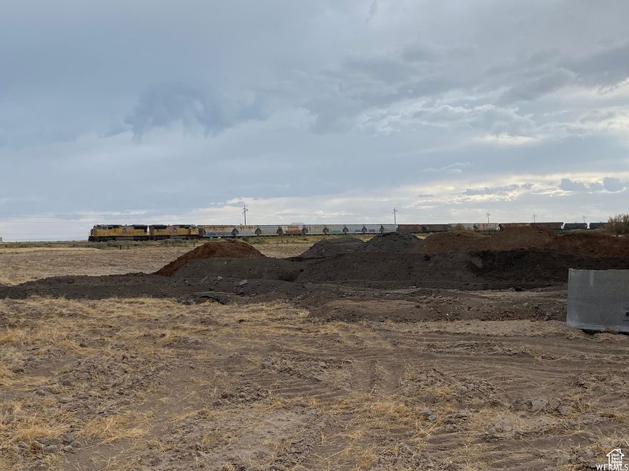 Included in the new inland port boundaries. Significant incentive available to further develop. $250,000 per acre with all or part of 20 acres available.  acres with very rare M-3  Zoning . May be used for general commercial activities. Large industrial development underway. Additional contiguous property is available. Less than 10 miles from major I-15 interchange and RR spur is close by. All utilities are available. This district is to be primarily for industrial uses related to the manufacture, testing, and production of jet and missile engines, aircraft or space craft parts or similar heavy industry, and for the extraction and processing of raw materials. Industrial operations or uses, which are compatible with the general purpose of this zone, are included