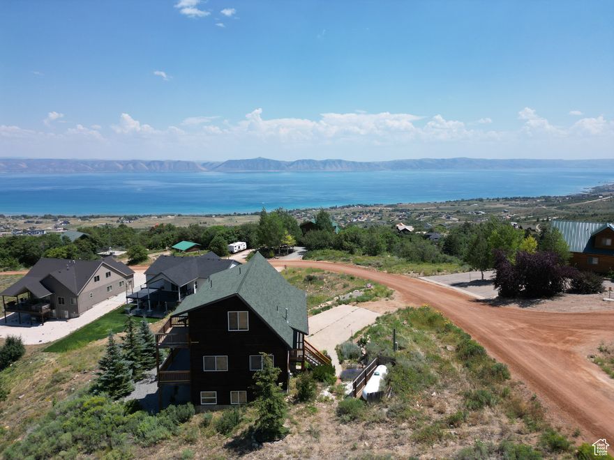 2 lots in this package. Beautiful 3 story home at the top of Bear Lake West Plat B. Year round access and stunning year round views. Direct access to atv & Snowmobile trails. Amazing master bedroom with private patio & bathroom. Cabin stained 2025. Trex decking replaced 2024 on 3 sides of home for amazing opportunities to enjoy Bear Lake. 3 bed 3 full bath with additional loft and 2 large family rooms. . Buyer and buyers agent to verify sq footage