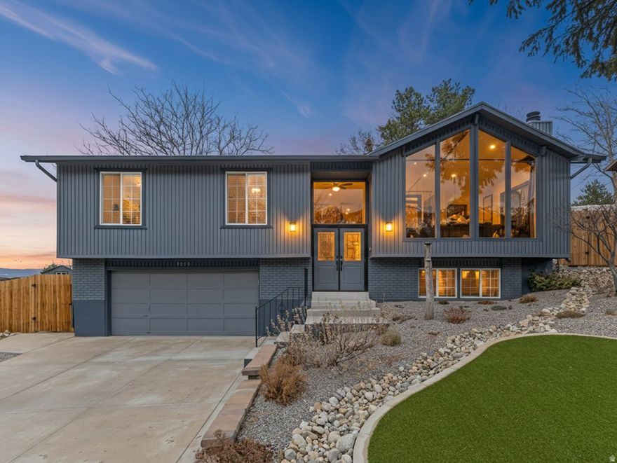 LOCATION, VIEWS and STYLE! Experience refined living just minutes from world-class skiing, premier biking and hiking, and year-round alpine recreation. This elegantly updated home offers majestic mountain views from the front and sunset and valley views from the backyard. As you enter, you're greeted by a light filled great room with a vaulted and beamed ceiling, picture windows framing the mountain peaks and lots of gathering space. The great room flows seamlessly into the updated designer kitchen which features a gas range with double ovens, stainless appliances, a stunning vertical backsplash, convenient walk-in pantry with barn door, an expansive island with beverage fridge, seating, cabinet space, quartz countertops and a spacious dining area. The primary suite hosts built-in closets and cabinetry as well as an additional closet, French doors to covered deck and a stunning bathroom. An additional full bathroom and bedroom round out the main level. The lower level features a bright family room, a junior suite with a full bathroom and a mudroom and laundry off the garage. The oversized two car garage is freshly painted, with a new epoxy floor and 220V for EV charging. The fully fenced yard is spectacular with xeriscaping, views of the mountains and valley, a huge deck, a 10x16 barn style shed and designated fenced RV parking with a second driveway cut. New roof and extensive improvements both inside and out-reflect exceptional care. A beautifully updated, move-in-ready residence offering luxury, comfort, and unforgettable views.