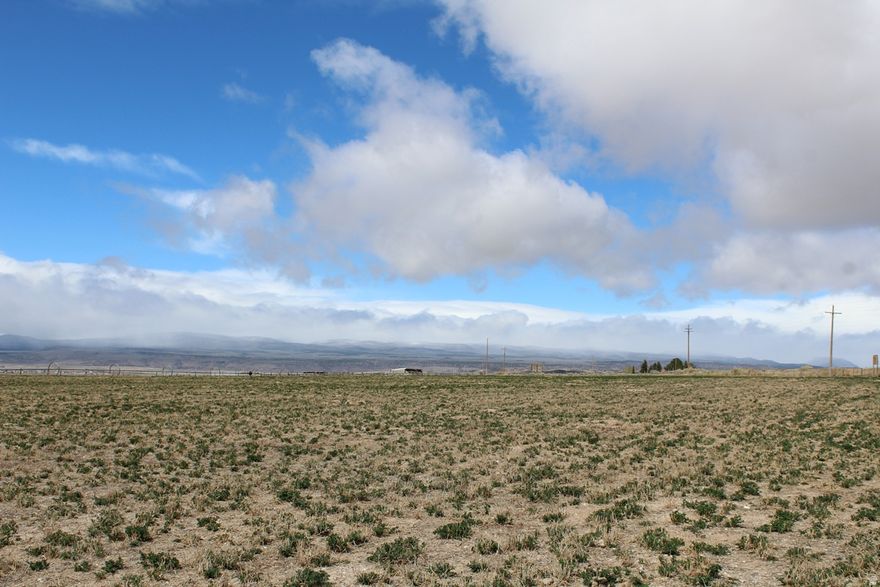 Ready To Build Parcel. 2.72 acre parcel located south of Lyman, a rural ranching community in Southern Utah where the scenery is pristine, the water is clean and the air is fresh. Incredible mountain and valley views in every direction. Utilities include access to Lyman Town water and power. The lot has already been surveyed and approved for a septic system. A road will be installed along the east boundary for smooth access. Light protective covenants to maintain quality while preserving the area's natural, rural charm. This property delivers space, scenery, and lasting value. Parcel 4, Torgerson Minor Subdivision.