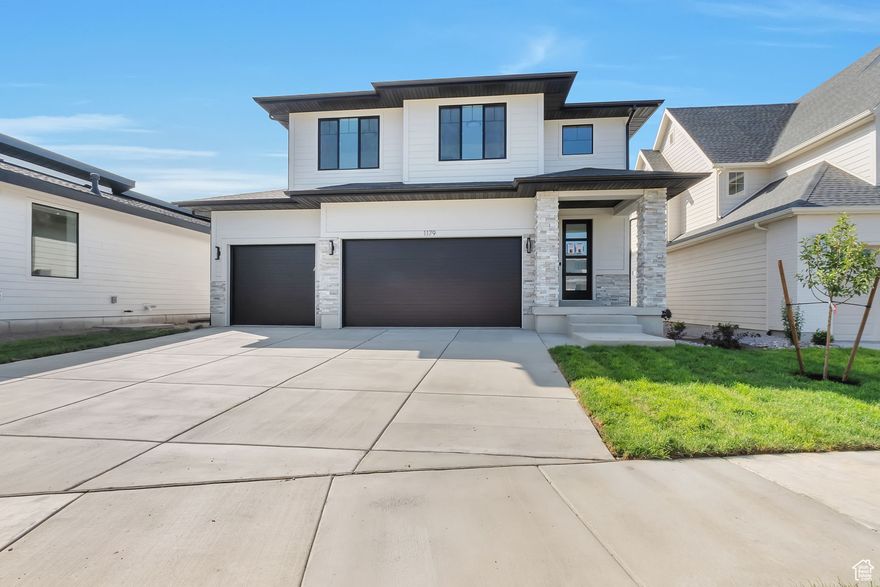 LOT #123  The "Saltair" by Symphony Homes This is the newest floor plan from Symphony Homes, located in a brand-new community with a fantastic location near everything. Come experience the difference in quality from this local builder of semi-custom homes. This spacious two-story offers thoughtful design, high-end finishes, and unique features throughout. The true three-car garage provides plenty of parking and storage. Inside, you'll find a large galley-style kitchen with a walk-in pantry, 36" gas cooktop range, double ovens, and a light-filled dining nook. The family room features a striking two-story ceiling and a cozy fireplace, perfect for gathering and entertaining. Upstairs, the ideal layout includes a large loft overlooking the family room, a primary suite with ensuite bathroom and walk-in closet, and two additional bedrooms with generous closet space. The finished basement adds a large family or game room and even more storage options. You'll also enjoy the spacious laundry room, a beautiful covered deck for outdoor living, and thoughtful extras like secondary water stubbed to the lot and an active radon system. The community includes common areas with a playground and scenic walking trails that border the neighborhood.