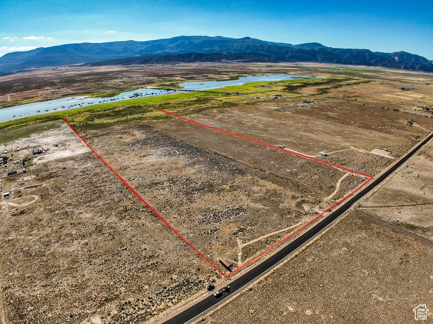 56+ Acres of Opportunity - Water, Power, and Room to Dream! If you've been looking for the perfect place to build, farm, or create your own country escape, this 56+ acre property could be exactly what you need! Flat, fully fenced, and ready for your vision, this land is a true blank slate with all the essentials already in place. Located just a short drive from Cedar City, you'll enjoy the peace and quiet of rural living while still being close to town for shopping, schools, and more. It's the best of both worlds-private and peaceful, but still convenient. Plus, with year-round access, you'll never have to worry about getting to your property, no matter the season. One of the biggest bonuses is the water. With 14.87 acre-feet of water rights, you'll have more than enough to support whatever you plan to do, whether that's farming, livestock, or building your dream home and garden. Even better, 12.87 acre-feet of that water comes with a priority date of 1900, which gives you excellent standing. A brand-new well has already been drilled, saving you time and money. Power is already to the property, making it easy to start building. No need to wait for utilities or go through long approval processes, this land is ready for you. Plus, with the flat terrain, construction or agricultural work will be straightforward and simple. With over 56 acres to work with, your options are wide open. Build a dream home and enjoy complete privacy. Create a homestead with animals and crops. Develop several homes. Or just hold onto it as a smart long-term investment. Whatever your dream is, this property gives you the space to make it real. This land is priced to sell and won't last long. Whether you want space to breathe, room to grow, or just a piece of the countryside to call your own, this is a rare opportunity you don't want to miss. Call today to schedule a visit and walk the land. You won't be disappointed!