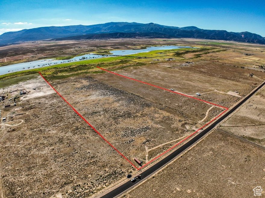 56+ Acres of Opportunity - Water, Power, and Room to Dream! If you've been looking for the perfect place to build, farm, or create your own country escape, this 56+ acre property could be exactly what you need! Flat, fully fenced, and ready for your vision, this land is a true blank slate with all the essentials already in place. Located just a short drive from Cedar City, you'll enjoy the peace and quiet of rural living while still being close to town for shopping, schools, and more. It's the best of both worlds-private and peaceful, but still convenient. Plus, with year-round access, you'll never have to worry about getting to your property, no matter the season. One of the biggest bonuses is the water. With 14.87 acre-feet of water rights, you'll have more than enough to support whatever you plan to do, whether that's farming, livestock, or building your dream home and garden. Even better, 12.87 acre-feet of that water comes with a priority date of 1900, which gives you excellent standing. A brand-new well has already been drilled, saving you time and money.  Power is already to the property, making it easy to start building. No need to wait for utilities or go through long approval processes, this land is ready for you. Plus, with the flat terrain, construction or agricultural work will be straightforward and simple.  With over 56 acres to work with, your options are wide open. Build a dream home and enjoy complete privacy. Create a homestead with animals and crops. Develop several homes. Or just hold onto it as a smart long-term investment. Whatever your dream is, this property gives you the space to make it real.  This land is priced to sell and won't last long. Whether you want space to breathe, room to grow, or just a piece of the countryside to call your own, this is a rare opportunity you don't want to miss.  Call today to schedule a visit and walk the land. You won't be disappointed!