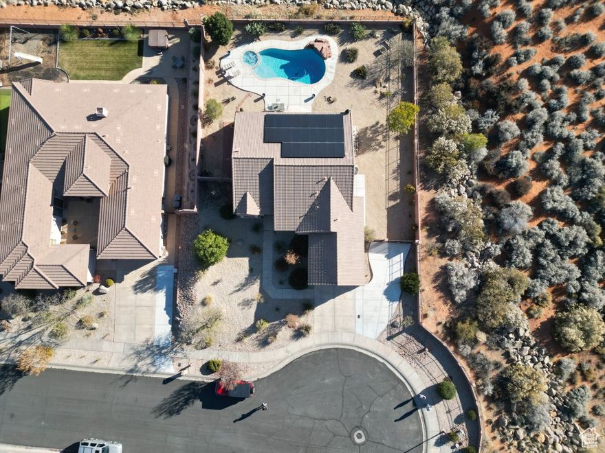 This LUXURY home is located in Coral Canyon with amazing views in every direction. Situated at the end of a quiet cul-de-sac with lots of open landscaping. This home has an open-concept floor plan. The master bath has a walk-in shower with two shower heads and a large his and hers walk in closet. This home offers lots of natural light throughout. There is a Salt Water inground pool with waterfall feature and an attached hot tub in the backyard with great views and plenty of privacy. This home is equipped with Solar Panels. The low HOA dues include a clubhouse with an indoor / outdoor pool, tennis / pickleball courts and a fitness room. Call listing agent for complete details and to schedule a showing. Listing information deemed reliable, buyer to verify.