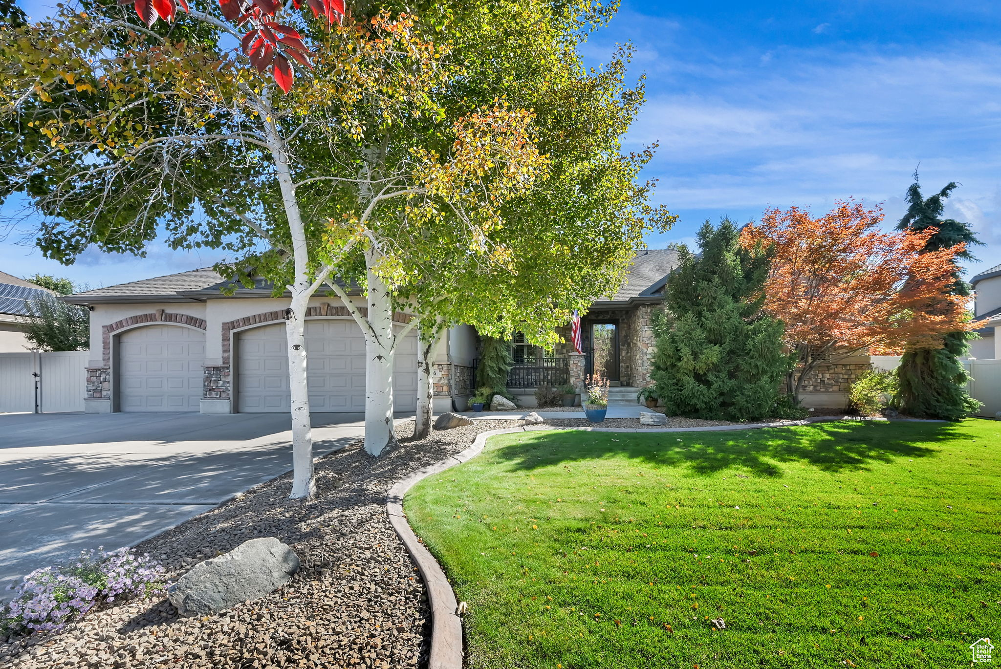 Beautiful, spacious and meticulously cared for, custom built 5-bedroom, 3.5-bath rambler with a 3-car garage with extra length on third car, set in a prime location with stunning mountain views and mature trees. This home features gorgeous hardwood floors throughout the main level, a well-appointed kitchen with granite countertops, and a vaulted great room perfect for entertaining. The private master suite includes a walk-in closet and a luxurious en suite bath. Bathrooms have been tastefully updated with quartz countertops. Plantation shutters throughout the entire home. The finished basement boasts 9'ceilings with separate entrance, includes a wet bar and refrigerator, offering an ideal space for gatherings. Plenty of storage. Permanent Jellyfish LED holiday lighting, programable to change for each holiday or season. Conveniently located near Hill Air Force Base, top-rated schools, shopping, parks, walking/biking trails, and just 30 minutes to Salt Lake International Airport and world-class skiing. This home combines comfort, style, and unbeatable access to Utah's best outdoor recreation. Buyer to verify all information. Seller related to Agent.