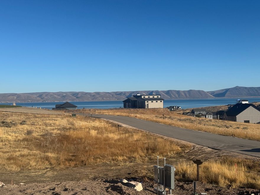 Build your mountain getaway in The Reserve at Bear Lake, a premier gated community offering privacy, paved roads, and top-tier amenities. This beautiful lot is fully improved with power, water, and sewer stubbed to the property, making it ready for your custom home. Enjoy direct access to nearby Fish Haven Canyon, where endless adventure awaits with trails for hiking, mountain biking, snowshoeing, snowmobiling, and UTV/ATV riding. Owners in The Reserve enjoy resort-style amenities, including a clubhouse with a fitness center, two heated seasonal pools, a year-round hot tub, splash pad, covered pavilion with grills, basketball, tennis, and pickleball courts, a playground, and gated beach access to stunning Bear Lake. Whether you're building a vacation retreat or full-time residence, this lot offers the perfect combination of natural beauty, recreation, and luxury living.