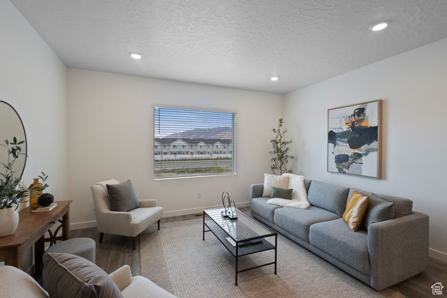 * A price that can't be beat and upgrades that can't be rivaled*  1092 E Vessel Ct puts you right in the heart of Northshore - Saratoga Springs' community built for connection, relaxation, and convenience. Within steps of the pickleball courts, a swimming pool, trails, and wide-open green spaces, it's the kind of neighborhood where weekends feel like a staycation.  The home itself sets the bar a step higher. The upgraded kitchen and appliance package give the main floor a polished, elevated feel. Down below, the crawl space is unlike what you'd expect - with over five feet of height, it feels more like a bonus basement than storage, offering room to organize, expand, or create.  Details like no immediate neighbors behind you, a driveway long enough to actually park in, and a built-in EV charger add real-world convenience you'll appreciate every day. Come find out why this unit stacks above the rest.