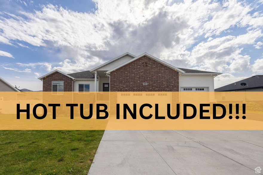 OPEN HOUSE SATURDAY SEPT 27 2pm-6pm!!! Welcome to your dream home in one of Tremonton's newer subdivisions! This beautifully maintained rambler is only a few years old and offers the perfect blend of modern comfort and thoughtful design. With 6 bedrooms, 3 bathrooms, and a fully finished open floor plan, there's plenty of room for family, guests, or a home office setup. You'll love the warm grey tones used throughout the home, creating a cozy, inviting atmosphere. The spacious kitchen and living area flow seamlessly together-ideal for entertaining or spending time together. Step outside to enjoy the double-tiered step-down firepit, perfect for relaxing under the stars, and soak your worries away in the included hot tub. The large backyard is ready for gatherings or quiet evenings at home. Don't miss the extra high 3 car garage with extra space for storage or hobbies, and just to finish it off,  Utopia Fiber is paid for outright so you won't pay a connection fee ever! Just choose your preferred internet provider. Homes like this don't come up often-schedule a tour today and see why this one stands out!