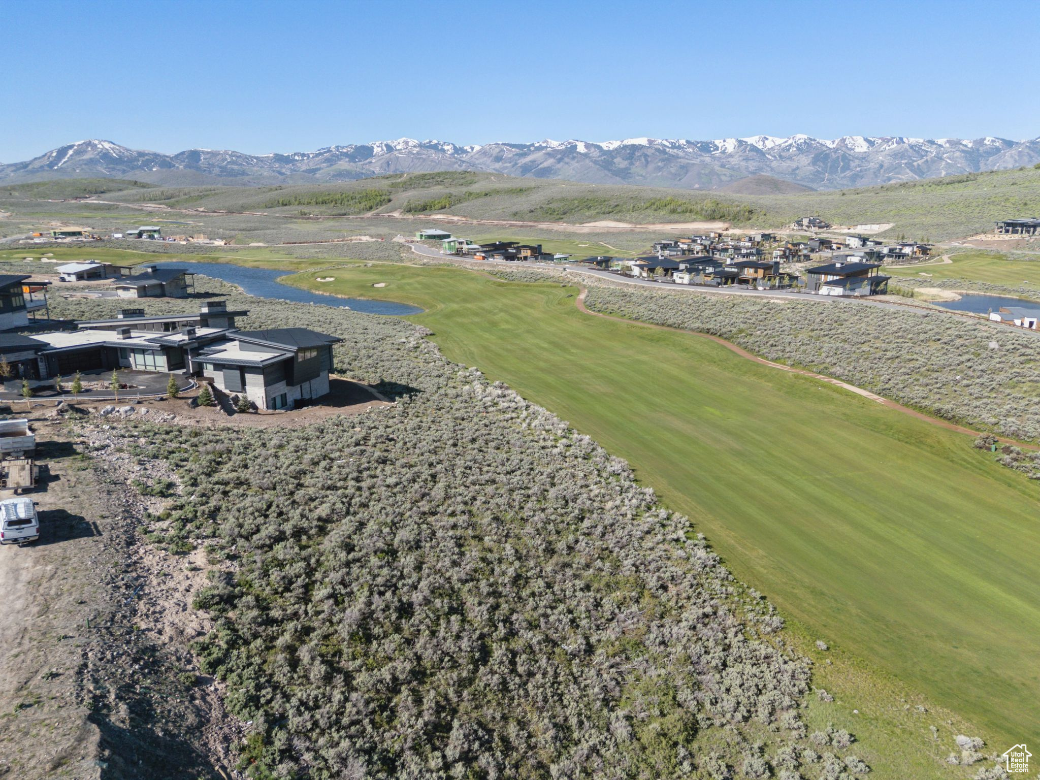Nestled on the 10th fairway of Promontory's renowned Nicklaus Painted Valley Course, this extraordinary 1.1-acre buildable lot in the exclusive Vista Point community offers an unparalleled opportunity to craft your dream mountain home. With expansive ski resort and golf course views, the property provides walkable access to the Nicklaus clubhouse, home to The Peak restaurant and Sage Spa. The upcoming third gate entrance off Browns Canyon Road, opening in Fall 2025, will enhance accessibility to Park City and its surrounding adventures. Promontory's exceptional amenities elevate this lot from mere real estate to a lifestyle destination. Owners can enjoy two spectacular 18-hole golf courses, a new par 3 course, seven distinctive restaurants, a beach club, outdoor opportunities such as fishing and water sports at the Jordanelle Reservoir, and members-only lodges at both Park City Mountain Resort and Deer Valley. All of these world-class experiences are just a short 20-minute drive from the historic charm of Park City's Main Street, making this Vista Point lot the perfect destination for your dream home in the mountains.