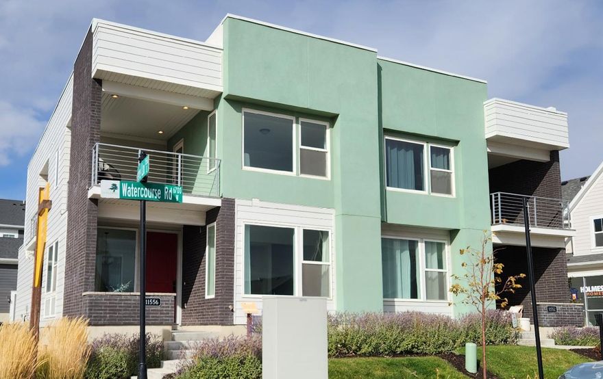 Fully Furnished Amazing Custom Model Home for sale with a limited time Interest rate buy-down special!  Move-In Ready. All of the furniture you see is included too!! For the folks that love indoor-outdoor living, this home is a must-see. This amazing designer model home plan has 4 covered patios! The open floorplan is welcoming and comfortable. It has upgraded countertops throughout including undermount sinks and faucets. In addition, in has stainless appliances including fridge and gas range. It also has beautiful 42" cabinetry with crown molding and a stunning backsplash. It has custom wall features and shelving too. It has a large owner's suite with a huge master bath walk-in shower & closet. And guess what else, it's own covered patio! The home has 3 bedrooms, 2.5 bathrooms and a 2 Car Garage. A fully furnished, move-in ready home. How perfect and convenient! It is an end unit home just a few doors down from the watercourse. Make sure you get the most out of your new home purchase, whether it's a Daybreak townhome or single-family home, Please Call today to find out more about this Fully furnished model home.