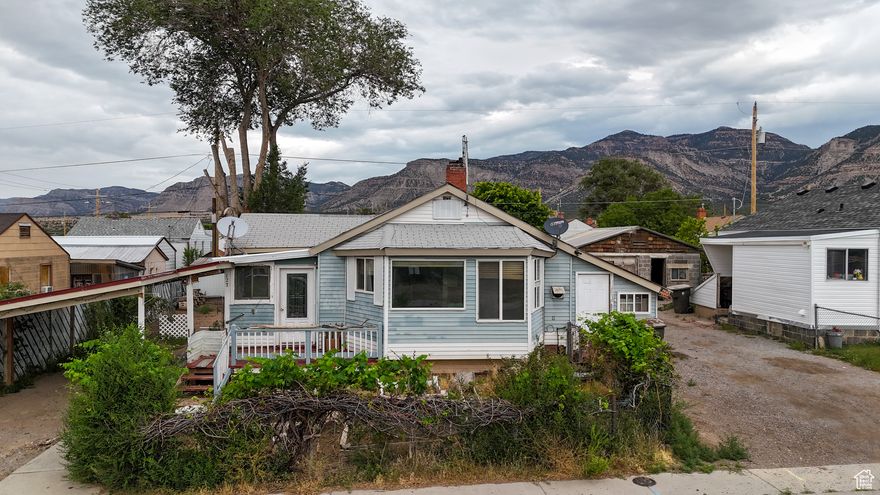 Charming Cottage with Mountain Views  Priced to Sell! This lovely cottage is waiting for a new owner to restore it to its former glory. Featuring a primary bedroom with en suite bath, this home offers great potential in a peaceful rural setting. Enjoy the tranquility of country living with scenic mountain views and abundant recreational opportunities just minutes away. The property includes multiple outbuildings and a spacious rear deck-perfect for relaxing or entertaining. Don't miss this opportunity to make this character-filled home your own. Schedule a showing today! Square footage figures are provided as a courtesy estimate only.  Buyer is advised to obtain an independent measurement.