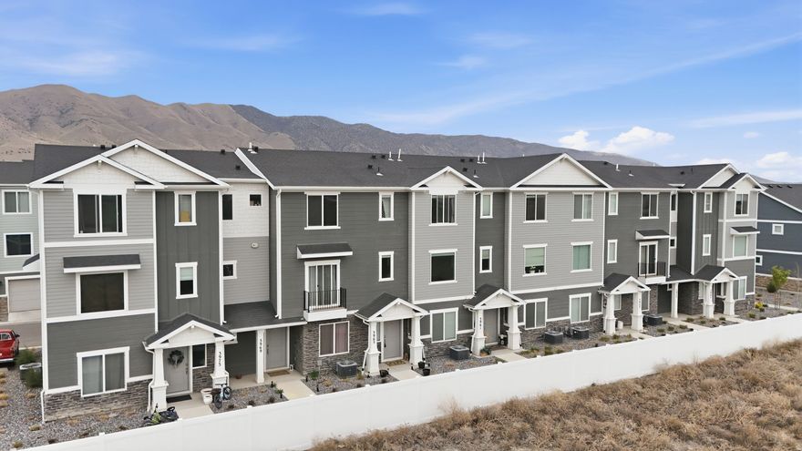 Welcome to the most spacious three story townhome designed for modern living and long term value in one of Utah County's fastest growing communities. The main level offers a versatile bedroom or office, full bath, and a convenient two car garage. Upstairs, you'll love the bright, open concept living space with 9 foot ceilings, it is perfect for hosting or simply enjoying everyday life. The top floor features a functional layout with laundry and three bedrooms, including a generous primary suite complete with a private bath and walk-in closet. Thoughtful extras like hidden under-stair storage and true pride of ownership make this home stand out. Enjoy HOA amenities including a clubhouse, pickleball courts, and a pool. Adding lifestyle appeal to an already incredible opportunity. Square footage figures are provided as a courtesy estimate only and were obtained from county records. Buyer is advised to obtain an independent measurement.