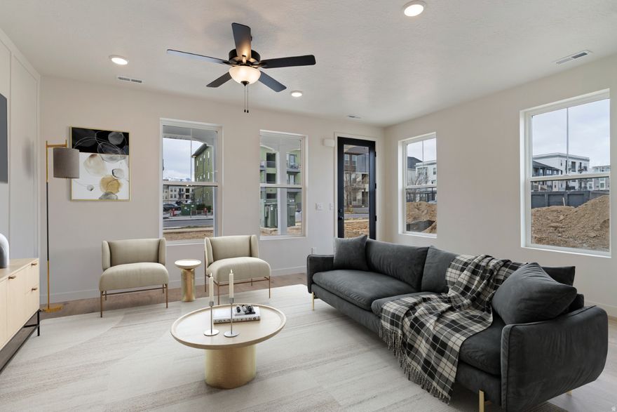 Move in before school starts and enjoy summer days in this spacious townhome in a vibrant, Downtown Daybreak. Less than a 10 minute walk to Soda Row, the library, or enjoy a Bees game at the new America First Square Stadium. The Downtown Daybreak area is known for community events and a lively neighborhood feel. The Houndstooth floorplan lives like a 2 story home, with 2 retreats that can be used for office space o gamerooms. Move in this summer and start enjoying everything this well established, Daybreak neighborhood has to offer. In-house lending options help make the process personalized, simple and straightforward. Photos and virtual tour are of previous Houndstooth floorplan home.