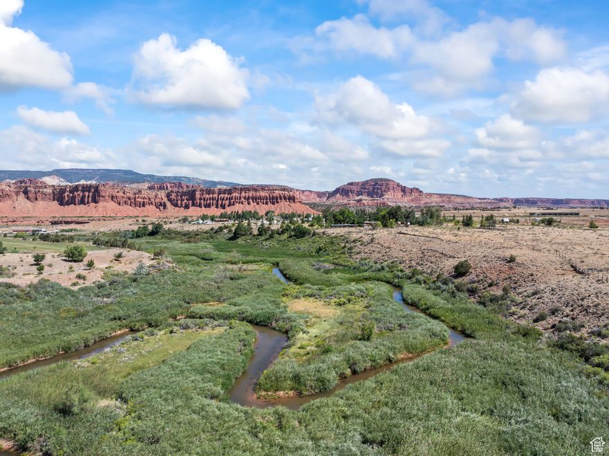 Discover an exceptional investment opportunity with this 30-acre Proposed Subdivision property in the picturesque town of Torrey, Utah. With all the groundwork already done, this parcel is ready for development. The individual lots are a prime selling point, with some offering coveted river frontage and all boasting panoramic red rock mountain views. Proposed Subdivision has had the traffic Feasibility study, Survey, approval for waste water system, Torrey town water and Plat map done. This is the perfect location for buyers seeking an escape to nature without sacrificing accessibility. Positioned near the entrance to Capitol Reef National Park and the starting point of Scenic Highway 12, this property provides a gateway to hiking, fishing, and a lifetime of outdoor adventure.