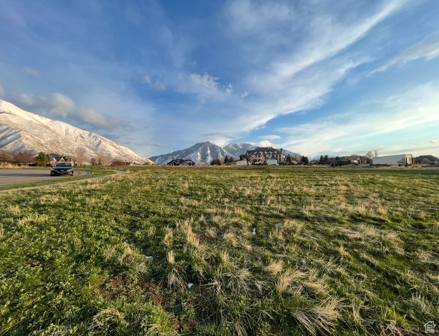 RARE opportunity to be part of one of the most coveted developments in Utah County. This expansive 1.78-acre lot in prestigious Triple Crown Subdivision has everything you could dream of. It is perfectly located in a quiet cul-de-sac with breathtaking views of the valley and mountain range. The sweeping 360-degree views of the Wasatch Mountains, Utah Lake, Utah Valley and surrounding open spaces and pastures are breathtaking. It is just far enough from the mountains to have the BEST views of the mountain ranges. The neighborhood to the NW is at a lower elevation, offering COVETED views of the valley, lake and mountains! There is a large pasture to the south that cannot be subdivided, offering open space with views of the southern mountain ranges. The sunsets at night will blow you away! What more could you want. Open space, views of the valley, views of the mountains, quiet cul-de-sac and an incredible neighborhood. You are a short distance to an amazing city park (IRA Allan Park). It has 2 Pavilions, a Playground, 4 Baseball Diamonds, Batting Cage, 14 Pickleball Courts, Futsal Court, Restrooms, and lights for those warm summer nights. Just to the east of the development is Mapleton's Parkway Trail, spanning across Mapleton into Hobble Creek Trail in Springville. You are just a short drive to Maple Canyon and Whiting Campground (16 campsites). One of the last houses in the subdivision was just completed to the west with landscaping almost completed. You will have one of the last opportunities to build in this stunning subdivision. DON'T MISS this chance to build your forever home right in the heart of paradise.