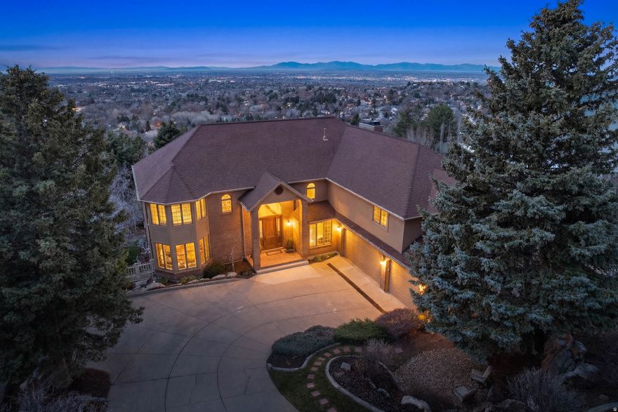 Panoramic views! Views from every window! Exclusive Shadow Valley Estates. Beautifully remodeled kitchen with custom cabinetry, upgraded appliances including Jenn Air gas stove, KitchenAid oven and dishwasher, and gorgeous granite countertops. Dramatic, newly remodeled grand entry. Two-story family room with exquisite floor-to-ceiling rock fireplace, formal living, and dining. Spacious, updated master suite. Private office with French doors. Open main floor kitchen and dining area flow seamlessly to large deck. Furnace and AC for upper level were replaced in 2016 and 2017, respectively. Lower-level water heater was replaced in 2023, and upper-level water heater was replaced in 2024. Roof was replaced in 2016.