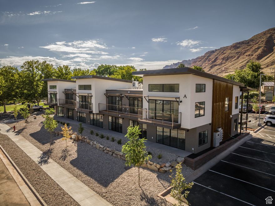 LIVE AND PLAY IN UTAH'S ADVENTURE CAPITAL! Located on the recreational pathway of Kane Creek Boulevard, Kane Creek Condominiums are a short walk to downtown Moab and minutes to all that Moab has to offer. Kane Creek Condominiums sits on over two acres located at the base of the Moab Rim. Each residence offers stunning views of towering red rock cliffs and the expansive Moab Valley with sights of Arches National Park, Swiss Cheese Ridge, and the La Sal Mountains. Only one mile from Moab's City Center, access to town is a short walk or easy bike ride away. Feeling the need for a morning power hike or mountain bike ride? Kane Creek Condominiums is minutes to the Pipe Dream trailhead, Moab Rim, Moonflower Canyon, and more! Each of the residences offer bright windows, modern finishes, wood grain vinyl luxury tile, independent laundry, and a dedicated parking spot, as well as access to dispersed parking and bike racks. Enjoy morning sunrise and evening sunsets from your private balcony or patio. Interior photos are of a similar unit.