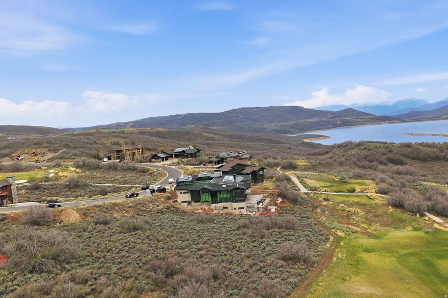 Exceptional homesite in the heart of Hideout offering rare, forever-protected panoramic views. This property captures breathtaking sightlines over a manicured golf course fairway, Jordanelle Reservoir, Mayflower Mountain Resort, and Deer Valley Resort. With no future development to obstruct these vistas, this is one of the few remaining lots where your view is truly permanent-an increasingly scarce opportunity.  Perfectly positioned for both convenience and recreation, this lot is just minutes from Mayflower, Deer Valley, and Park City resorts, while also offering easy access to Heber City, Salt Lake City, and Salt Lake City International Airport.  Enjoy year-round outdoor adventure right at your doorstep, including boating on Jordanelle and Deer Creek Reservoirs, world-class fishing on the Provo River, and endless opportunities for skiing, hiking, and mountain biking.  Fully approved house plans are available for purchase with the property, providing a valuable head start toward building your custom mountain retreat.  A premier view lot combining unmatched scenery, location, and lifestyle-this is mountain living at its finest.