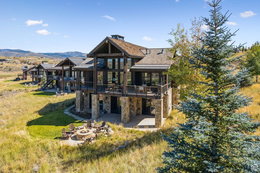 Perfectly located within walking distance to the Barn Clubhouse, this three bedroom Willow residence offers the ideal blend of convenience, comfort, and breathtaking scenery. Floor-to-ceiling windows frame panoramic views of the Rees Jonesdesigned golf course, Deer Valley, Wasatch Mountains and dramatic Rock Cliffs. Inside, living spaces are open and welcoming, enhanced by soaring vaulted ceilings, Duchateau flooring, automated shades, warm wood and stone gas fireplace surround and mantle. On the main level is the chef's kitchen featuring Viking appliances, and the expansive great room is perfect for entertaining. Private bedroom suites, including a luxurious main floor primary bedroom, provide retreat-like comfort. Outdoor living is elevated with spacious decks, patios and firepit, designed to capture sunrise, sunset, and star-filled skies. The walk-out lower level includes an additional living space with custom built in shelving, gas fireplace, two bedrooms and two baths  each with heated floors.  Victory Ranch is a private, four-season community set across 6,250 acres and four miles of the Upper Provo River.  Residents enjoy a lifestyle that blends adventure and relaxation, with amenities that include multiple clubhouses, each featuring dining and recreation options, an 18-hole Rees Jonesdesigned golf course, world-class fly fishing, and over 30 miles of mountain biking and hiking trails set in the 3500 acres of untouched backcountry. Enjoy walking to access the Barn Clubhouse, which features paddle-tennis, pool with water slide, restaurants, spa, and much more. The community also features a 5-stand shooting facility, archery range, 4x4 and snowmobile adventures, kids' zip line, backcountry yurts, fishing ponds, and a ski-in/ski-out lodge in Park City -plus private shuttles to Deer Valley and Park City.