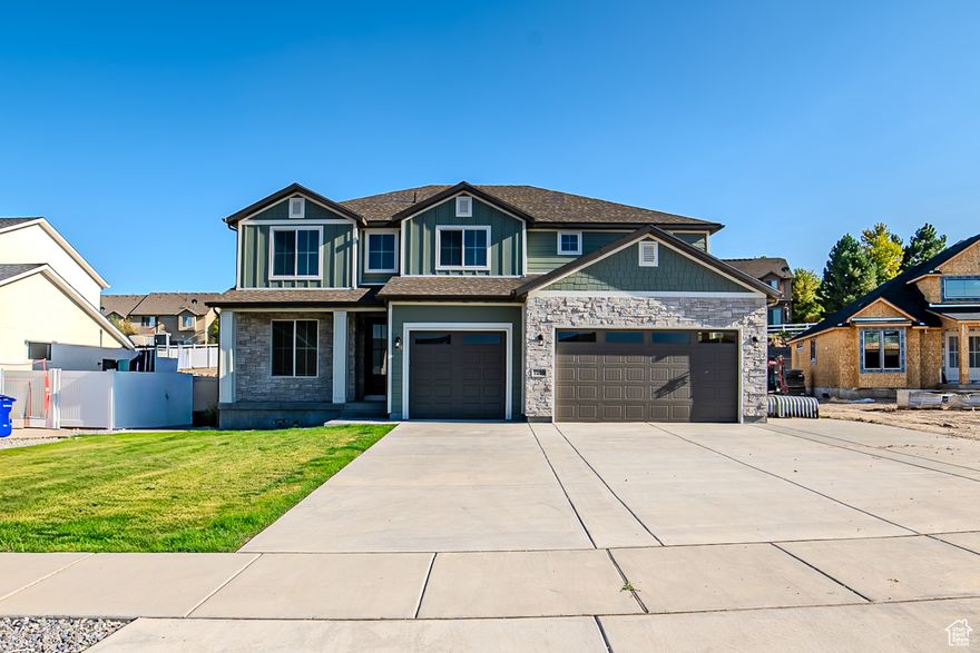 The Witzel Floorplan with a two-story vault living room and a main level suite this home is an open and spacious concept. Large designer kitchen with custom pulls, plumbing, and stainless steel appliances. Laminate hardwood, upgraded carpet, designer wall finishes.