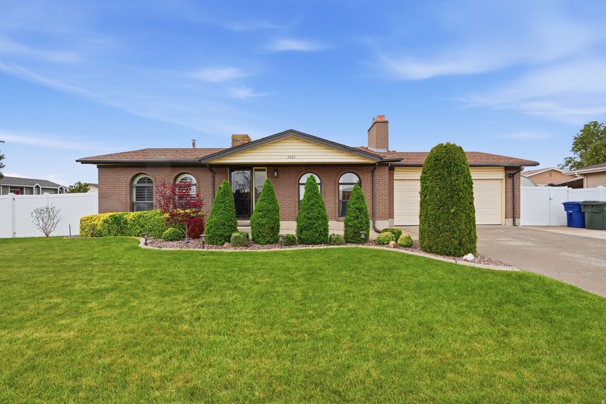 ** OPEN HOUSE this SATURDAY 5/9 from 11AM-1PM **.  Immaculate inside and out, this meticulously landscaped all-brick rambler shows like a true model home and has been exceptionally cared for from top to bottom. From the moment you walk in, you'll appreciate the warmth and quality throughout, featuring plantation shutters, beautiful 6" LVP wood plank flooring, new carpet, and an inviting open layout filled with natural light. The fully remodeled kitchen is a standout with stunning level 3 granite countertops, a custom tile backsplash, dark stainless steel appliances, and a sleek forward-control stove that perfectly blends style and functionality. The spacious basement family room is ideal for entertaining or relaxing, complete with a cozy fireplace, custom built-ins, and stained concrete flooring that adds both character and durability. A gorgeous sunroom with a heater offers the perfect retreat with an abundance of natural light and year-round comfort. The oversized laundry room provides exceptional storage and workspace, while the super clean garage is fully equipped with built-in cabinets and a workbench for ultimate organization. Major system updates include central air, a water softener, furnaces installed in 2017, and a water heater replaced in 2024, giving peace of mind to the next owner. The flexible floorplan offers endless possibilities, with the current owners utilizing the large basement bedroom as the primary suite and the adjoining office as a custom walk-in closet. It's important to note that the washer and dryer are top of the line and include included! Step outside to a large, private backyard designed for both relaxation and functionality, featuring beautifully maintained landscaping, custom planter boxes, RV parking, a fully fenced yard, a dedicated dog run, and a storage shed for all your tools and outdoor equipment. With its pristine condition, thoughtful upgrades, and incredible pride of ownership throughout, this home is truly one of a kind. Just minutes from 215 and Bangerter Highway this location is convenient to get anywhere you need to go!