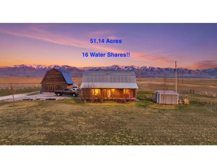 Huge Price Drop, priced to sell! Tucked away on over 51 acres of wide-open freedom, this one-of-a-kind log home is more than a property - it's a lifestyle. If you've been dreaming of space, privacy, and true country living, this is the opportunity you've been waiting for.  The property comes with 16 water shares, livestock fencing, and pressurized irrigation all the way to the end of the land, plus water run throughout for easy animal access - making it ready for livestock or hobby farming from day one.  A detached garage/shop with full power and 220V for a welder or compressor provides the perfect workspace, and the backhoe is included to help you shape the land however you like. Nearly off-grid, the home runs on a private well and propane - add solar panels and you could create your own self-sustaining sanctuary.  Bordering a waterway with recreational opportunities for hunting and fishing, this property offers the perfect balance of productivity, play, and privacy. Whether you want room for livestock, a homestead, or simply to get away from it all, this is the ultimate country escape.
