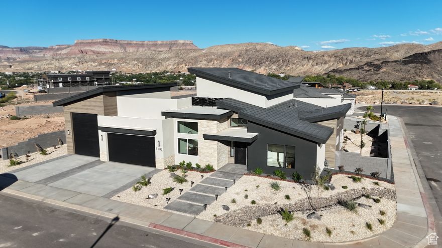 **Seller Offering $20k Toward Buyer Concessions** Experience modern luxury in this brand new 4 bedroom, 5 bathroom home spanning 3,257 sq. ft. across two levels. The open-concept floor plan showcases vaulted ceilings, large windows throughout, and 8-foot sliding doors that fill the home with natural light and seamlessly connect indoor and outdoor living. Enjoy panoramic views along the ridge of the Virgin River from multiple vantage points, creating a stunning backdrop for everyday living and entertaining. This contemporary home combines thoughtful design with breathtaking scenery for an exceptional living experience.