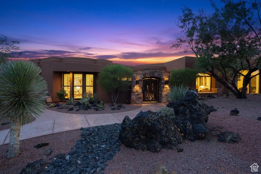 A Private Desert Retreat in Prestigious Entrada! Set on nearly an acre, this mid-century modern inspired home offers privacy, elegance, and breathtaking views of Southern Utah's red rock landscape. Located on Chaco Trail in Entrada, the residence enjoys direct proximity to the community's world-class private golf course, host to PGA and LPGA events. The home spans nearly 5,000 sq. ft. with 3 bedrooms, 3.5 baths, and a thoughtfully designed layout. The main-level primary suite provides a private retreat, while a separate casita with its own living room and bedroom creates ideal guest accommodations. Walls of glass frame desert vistas and fill the home with natural light. Outdoor living includes a built-in BBQ, spacious patio areas, and a custom water feature surrounded by desert landscaping. Residents also enjoy Entrada's private clubhouse, resort-style pools, fitness, tennis, pickleball, and dining. A truly one-of-a-kind property offering privacy, architecture, and lifestyle.
