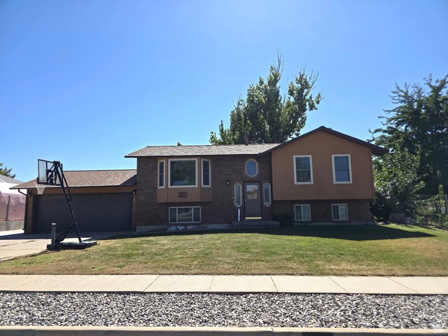 **SELLER TO INCLUDE $8,000 IN CLOSING COSTS!** Charming, well-maintained 4-bedroom, 2 full bath home sits on a spacious .28-acre corner lot and offers a perfect blend of comfort, functionality, and room to grow. Step inside to find beautiful wood floors, an inviting layout, and a kitchen featuring stainless steel appliances. Enjoy outdoor living on the huge covered deck, perfect for entertaining or relaxing evenings. The backyard includes a large storage shed and plenty of space for activities. The walk-out basement provides great potential to create a mother-in-law apartment or additional living space. You'll also love the convenience of an extra-deep two-car garage and an RV pad with room for your trailer, boat, or extra vehicles. Close to and minutes away from Hill Air Force Base, Freeway Access, and wonderful shopping, parks, and schools!  Don't miss this opportunity to own a versatile home in a desirable West Point location with space inside and out to make it your own! Buyer to verify all info!