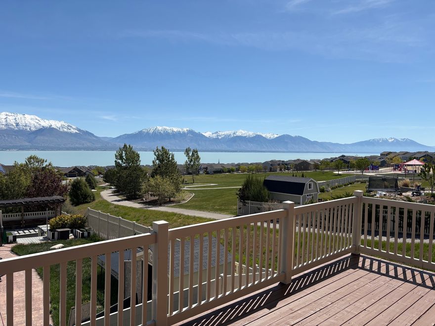 Breathtaking Views of Utah Lake grace this Parkside estate, checking all of your boxes! Spacious Lake facing deck also overlooks the sprawling adjacent Community Park. True two-family living if desired with a full walkout basement including kitchen, 2 bedrooms and massive Theater room. Over $45,000 just spent in two new HVAC systems, new 50 gal Water Heater, new Soft Water System, Fresh Paint & Lighting & many New Windows. Views from most every window create an unmatched fresh & peaceful open feel. Dramatically oversized 3 Car Garage features extended depth in 2 of the 3 bays with additional Off Road Parking adjacent to Walk Out Basement. Expansive ceilings, secluded corner lot with only one adjacent neighbor...the pictures say it all! Make sure to click on "tour" for your enjoyment! Square footage figures are provided as a courtesy estimate only. Buyer is advised to obtain an independent measurement.