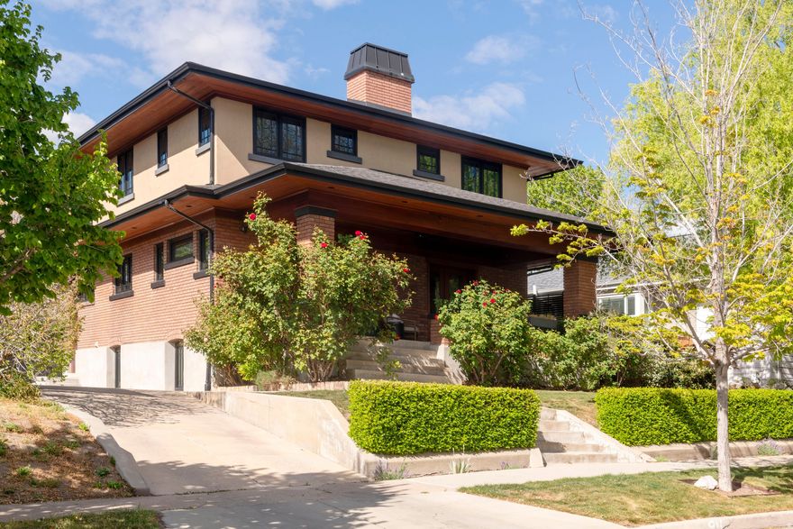 Absolutely stunning remodeled two-story showcasing exceptional 1920s Arts & Crafts architecture. Period-appropriate woodwork throughout includes a built-in bookcase, beamed ceilings, and classic wood columns that highlight the home's historic character. The beautifully designed custom kitchen features shaker-style quarter-sawn white oak cabinetry, granite countertops, tile backsplash, and high-end lighting. True divided light Sierra Pacific windows bring in abundant natural light. The open main-floor living, kitchen, and dining areas create an inviting space, with French doors leading to a spacious front sitting porch and a back deck perfect for entertaining.  A sweeping staircase filled with windows adds architectural drama and light. Upstairs offers an excellent floor plan with a lovely primary suite featuring its own fireplace and a spacious, tastefully designed bath with soaking tub, large walk-in shower, and heated floors. A convenient upstairs laundry room includes built-in cabinetry and a utility sink.  The basement boasts high ceilings, a comfortable family room, two additional bedrooms, and a large bathroom. All basement rooms include egress windows. Professionally decorated throughout. Additional features include a new garage with attic storage. Located just half a block from the vibrant 15th & 15th district, with a neighborhood bakery, wine bar, Italian deli, gelato shop, bookstore, and beloved local restaurants.  Homes with this level of craftsmanship and quality rarely come on the market.