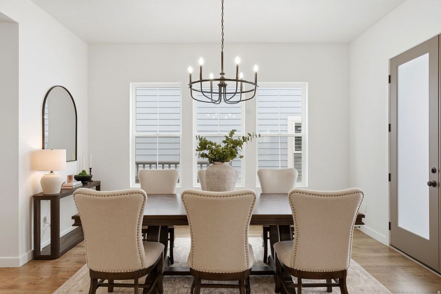 Skip the new construction process and come see this immaculate home, built in 2023, in Daybreak's premier Ascent community. Boasting 4,433 sq. ft., this 3-bedroom, 2.5-bathroom residence has been meticulously maintained to a better-than-new standard. This beauty features designer interiors with an open-concept family room, 9ft ceilings, and a gourmet kitchen anchored by a gorgeous 10ft quartz island. Enjoy main-level living with the convenience of a primary suite and laundry room on the main floor. Additionally, you'll find a private office with elegant French doors, a spacious formal dining area perfect for hosting, and a half-bath for guests. Upstairs, you will find a bonus flex space, two additional bedrooms, and another full bathroom! The exterior is fully landscaped with an automatic sprinkling system and a fully fenced, private backyard. This home also features a high-efficiency dual-zone HVAC system for consistent temperatures throughout. The expansive, unfinished basement offers unlimited growth potential. With plumbing already in place for a bathroom, you can easily add more bedrooms and a secondary living area to suit your lifestyle. Perfectly situated steps from the Daybreak Watercourse, you'll enjoy unparalleled access to Oquirrh Lake and miles of biking and walking trails. You are also close to top-rated schools, shopping, dining, TRAX, and the new Bees Stadium. Don't miss this opportunity-it's move-in ready and waiting for you! Square footage figures are provided as a courtesy estimate only and were obtained from county records. Buyer is advised to obtain an independent measurement and verify all information contained within.