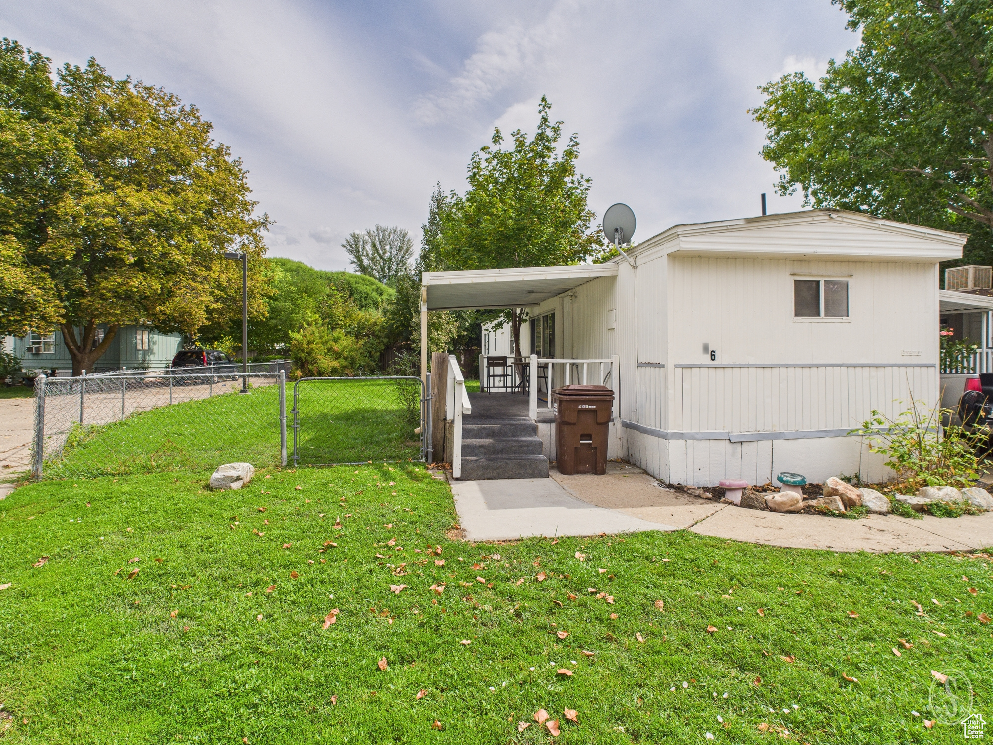 Nicely updated manufactured home with a LARGE FULLY FENCED YARD, covered patio and a carport. This 2-bedroom / 1 bath home has lot rent under $1,000, which is getting harder to find. Great area with plenty of trees.