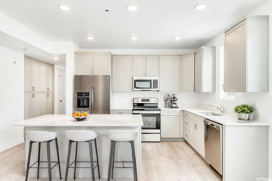 Exceptional value for new construction in Daybreak! Modern condo located directly across from Downtown Daybreak with stunning Wasatch Mountain views. Bright, open floor plan with contemporary finishes and abundant natural light. Walk to shops, dining, parks, entertainment, and UTA TRAX Red Line. Rare opportunity at this price point-limited availability. Visit sales office at 5263 W Reventon.