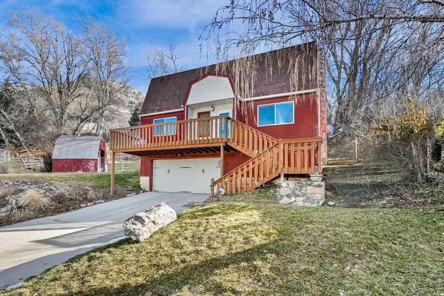 Escape to mountain-base living with sunsets that steal the show. Set in a desirable Brigham City foothills neighborhood, this one-of-a-kind, cabin-style home offers peaceful getaway vibes while staying close to town. Fresh interior paint brightens every space, complementing the updated kitchen, cozy fireplace, and unique character. Enjoy your front-row seat to beautiful sunrises and unforgettable sunsets. Yes, there are stairs, but that's how you earn the views and privacy single-level homes can't offer. A rare blend of charm, location, and value in a high-demand foothills setting.