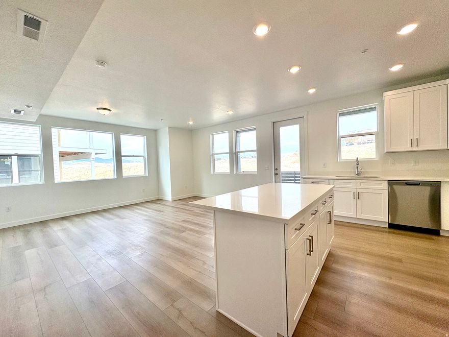 Gorgeous New Condo at Jordan Bluffs- Fully Completed & Move-In Ready!  Experience modern living in this beautifully finished brand-new 3-bed, 2-bath condo located in the highly sought-after Jordan Bluffs community. This home is just completed and ready for immediate occupancy, no waiting for construction!  Step inside to an open, light-filled floor plan featuring stunning upgrades throughout, including wide-plank laminate flooring, crisp white cabinetry, quartz countertops, and stainless steel appliances. The spacious primary suite offers a private en-suite bathroom and a large walk-in closet for ultimate comfort and convenience.  Enjoy seamless indooroutdoor living with a 17' x 5'6" private deck off the kitchen and living room- perfect for morning coffee, grilling, or unwinding at sunset.  Located in the center of the valley, you'll love the unbeatable access to shopping, dining, parks, schools, and entertainment, plus super-easy commuter routes with quick freeway access. Many units built and under construction, or build your own and choose colors, fixtures and finishes!