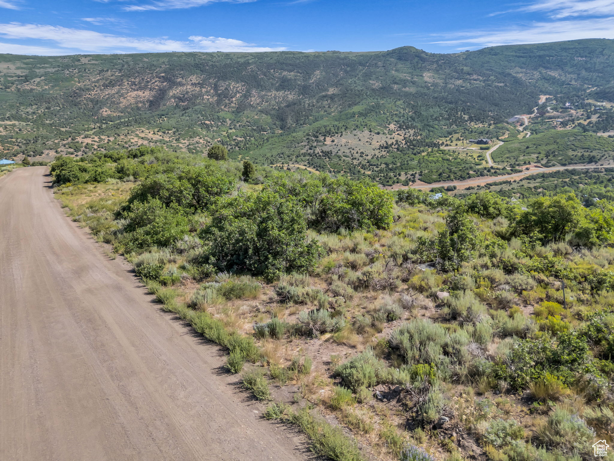 Build your dream mountain home on this 1-acre lot in the private, gated community of Timberlakes, just minutes from Heber City and a short drive to Park City. This gently sloped lot offers panoramic views of Mt. Timpanogos, close to the gate for year-round access, and a peaceful mountain setting-perfect for a full-time residence or vacation retreat. Perc test completed and building plans available. The parcel to the North is open space and ensures lasting privacy and unobstructed views. Timberlakes is a secure mountain community offering privacy, abundant wildlife, and access to hiking, ATV trails, snowmobiling, and more. Whether you're ready to build now or planning for the future, this is a rare opportunity to own a premium lot in one of Heber Valley's most desirable mountain neighborhoods.