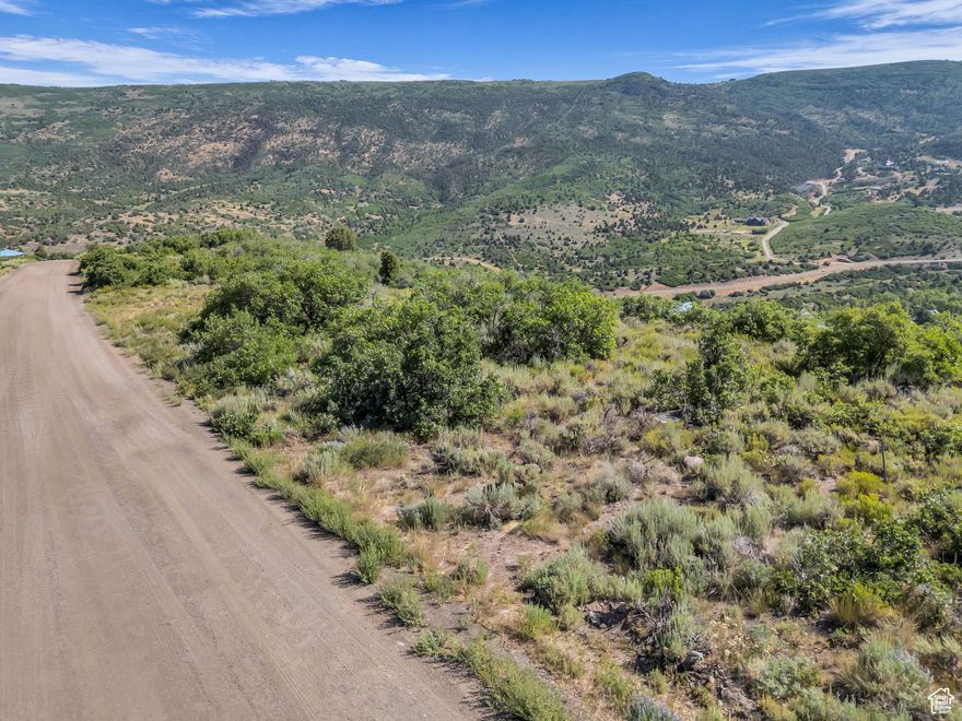 Build your dream mountain home on this 1-acre lot in the private, gated community of Timberlakes, just minutes from Heber City and a short drive to Park City. This gently sloped lot offers panoramic views of Mt. Timpanogos, close to the gate for year-round access, and a peaceful mountain setting-perfect for a full-time residence or vacation retreat. Perc test completed and building plans available. The parcel to the North is open space and ensures lasting privacy and unobstructed views. Timberlakes is a secure mountain community offering privacy, abundant wildlife, and access to hiking, ATV trails, snowmobiling, and more. Whether you're ready to build now or planning for the future, this is a rare opportunity to own a premium lot in one of Heber Valley's most desirable mountain neighborhoods.
