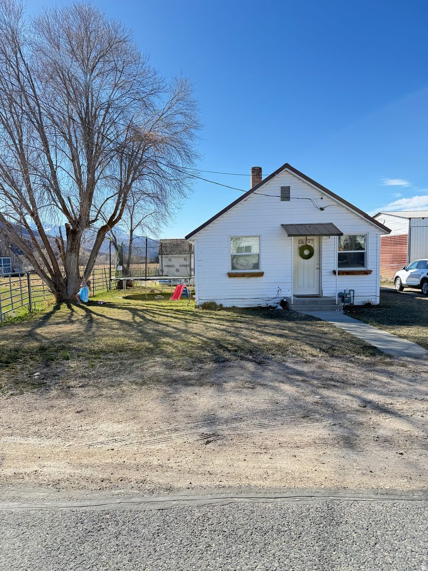 Enjoy the peace and quiet of country living with this charming 2-bedroom, 1-bath home located on .38 acres in scenic Heber City. Set in a calm and spacious area, this property offers a rare opportunity to enjoy open space, mountain surroundings, and a slower pace of life while still being just minutes from town amenities.  Located at 3224 S Daniels Rd, the home features several recent upgrades, including a new furnace and a new water heater, providing comfort and peace of mind for the next owner. Also features a spacious shed behind the property for extra storage.  The property offers excellent potential for expansion, making it ideal for buyers who want to build onto the existing home or add additional living space in the future. One of the standout features of this property is the spacious back field, which provides an opportunity for extra storage or parking for equipment, trailers, boats, RVs, or other items. This creates the potential to generate additional monthly income by renting out storage space. It also provides the opportunity to keep animals fenced in on the property as well.   Whether you're looking for a starter home, investment opportunity, or a property with expansion and income potential, this home offers a unique chance to own in one of Utah's most desirable mountain communities.  All property information is deemed reliable but not guaranteed. Buyers are advised to conduct their own due diligence and verify all details including square footage, zoning, property use, and potential expansion opportunities.