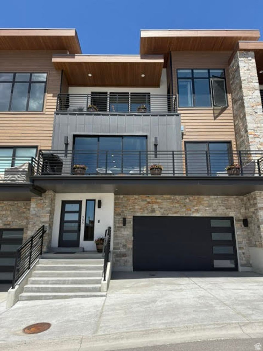 Imagine waking up to incredible views of Jordanelle Reservoir in this contemporary townhome  it's the perfect blend of modern luxury and a savvy investment. Every detail is considered, from the rich wood flooring and pristine quartz countertops to the effortless motorized blinds. The bright, open living space and fully stocked kitchen are ideal for everything from quiet evenings to lively gatherings. Step out onto one of the multiple decks to truly appreciate the captivating scenery. Plus, an attached two-car garage adds everyday convenience. The biggest draw? The ability to offer nightly rentals, turning this dream home into a powerful income generator. The square footage is approximate, sourced from tax data. It is recommended that the buyer obtain an independent measurement to verify all information independently, confirming all property attributes, inclusive of square footage and land extent, to their personal standards.