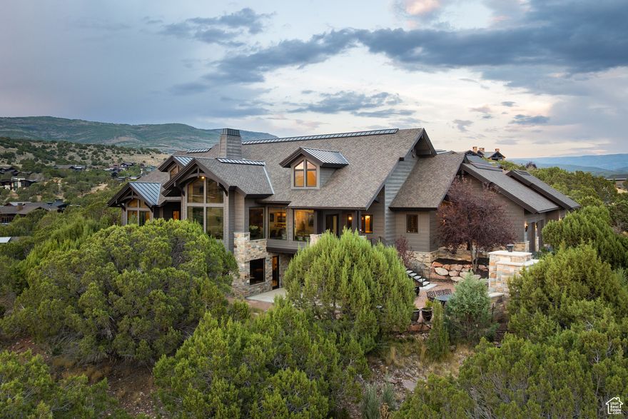 This stunning mountain retreat offers panoramic views of Mt. Timpanogos and the iconic red rock formations, nestled on a generous 1.29-acre parcel surrounded by juniper trees and natural landscaping. The open-concept floor plan features exceptional indoor and outdoor gathering spaces, along with seven beautifully appointed en-suite bedrooms. Every detail has been thoughtfully designed to create a home that seamlessly blends comfort, luxury, and functionality in a truly breathtaking setting. This is a true legacy property.  A full Red Ledges Golf Membership is available with the home, granting access to one of Utah's premier private golf communities. Enjoy world-class amenities, including a Jack Nicklaus Signature Championship Golf Course,  Golf Park, tennis, swimming pools, pickleball, fine dining, an award-winning fitness center, an equestrian facility, and a ski program complete with seven-day-a-week shuttle service.