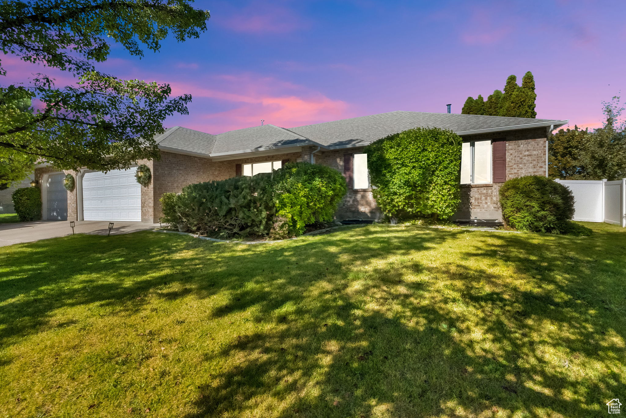 Welcome to this spacious 6-bed, 4-bath rambler in South Jordans Wasatch Meadows South. Over 4,100 sq ft of finished living space with vaulted ceilings, a double-oven kitchen with double appliances, and a bright open layout. Primary suite with walk-in closet and private bath. Basement features a family room with fireplace, jetted tub, 3 bedrooms, and storage. Enjoy the .24-acre fenced lot, covered patio, 4-car tandem garage with workbench, and Google Fiber readiness. Near Bingham High, Welby Elementary, and Mountain View Corridor. Move-in ready and beautifully maintained!