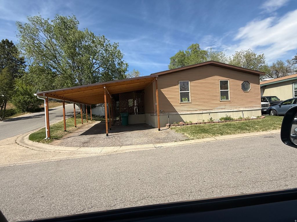 Photo of 2875 N HILLFIELD RD #111, Layton, UT 84041 (MLS # 2153476)