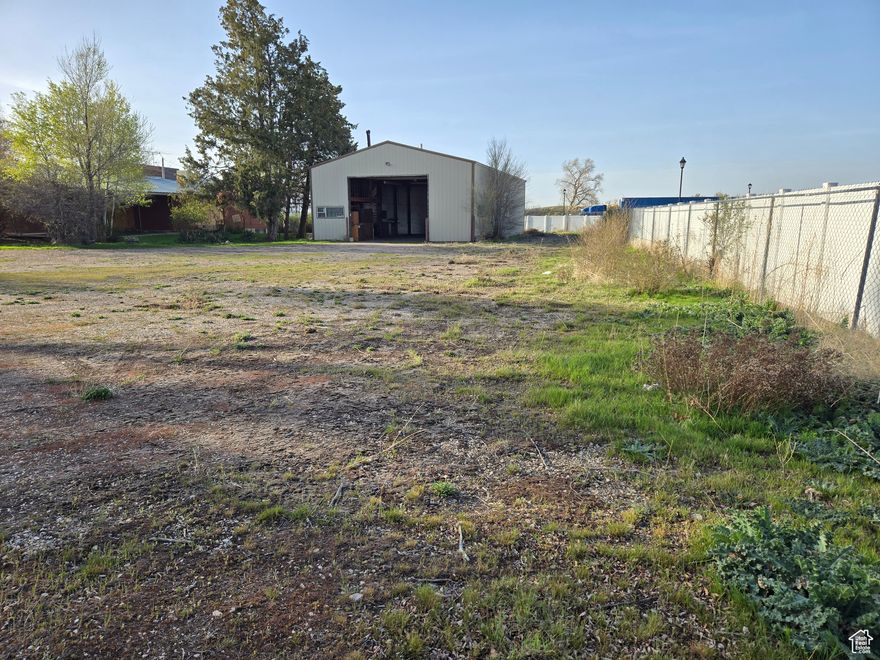 Next to a hotel, restaurant, and bank with nice vinyl fencing on 3 sides. A brick house, a metal shop, and a metal shed are currently on the property and all are functional. Please call Marriott-Slaterville city office for a current list of approved uses @ 801-627-1919. All buyers are advised to obtain independent measurements for square footage & lot size.