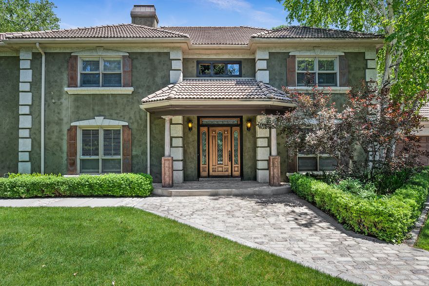 "The Holladay House" - a rare European-style estate nestled on a gated, secluded 1-acre property in the heart of Holladay. Offering over 5,600 square feet of all-above-grade living space, this home combines timeless design, privacy, and opportunity in one of Utah's most desirable neighborhoods. The two-story layout flows beautifully, featuring an open kitchen with granite countertops, gas range, double wall ovens, walk-in pantry, and built-in appliances. The large primary suite offers a separate fireplace sitting area, vaulted ceilings, jetted tub, and walk-in closet. Thoughtful details include plantation shutters, built-in speakers, wet bar, French doors, and abundant natural light throughout. Step outside to a resort-style backyard with a pool, waterfall and pond, fruit trees, gardens, and mature landscaping. A garden/potting cottage in the elevated back yard is perfect for the gardening professional, and 3-car garage with lots of storage, completes the amazing setting. Located just minutes from Holladay Village, ski canyons, top-rated schools, dining, and shopping, this property offers unmatched location, livability, and future potential. A truly rare Holladay opportunity. Square footage figures are provided as a courtesy estimate only. Buyer is advised to obtain an independent measurement.