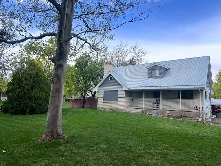 This is an exceptional multi-functional property offering flexibility, income potential, and unique features in Hyrum, Utah.   The home is thoughtfully configured with three separate living areas, each with private access, and enhanced by dual power meters for added convenience.   Some standout features include a large landscaped backyard, RV parking space and a glass atrium with hot tub hookups, perfect for creating a private indoor oasis.  Whether you're looking to offset your mortgage, or accommodate multi-generational living, this property delivers unmatched versatility.